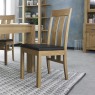 Bentley Designs Turin Light Oak 6 Seater Dining Set & 6 Slat Back Chairs Upholstered in Brown Faux Leather- chair feature