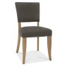 Bentley Designs Indus Rustic Oak 4 Seater Circular Dining Set & 4 Upholstered Chairs in Dark Grey Fabric- chair front angle