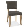 Bentley Designs Indus Rustic Oak 6-8 Seater Dining Set & 6 Upholstered Chairs in Dark Grey Fabric- chair front angle